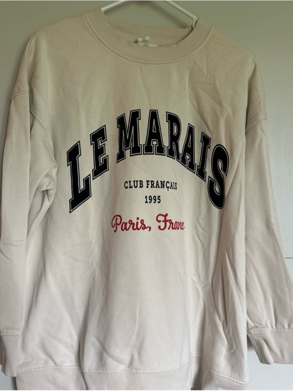 H&M Cream Sweatshirt with Black and Red Graphic